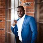 man in blue suit jacket and white dress shirt